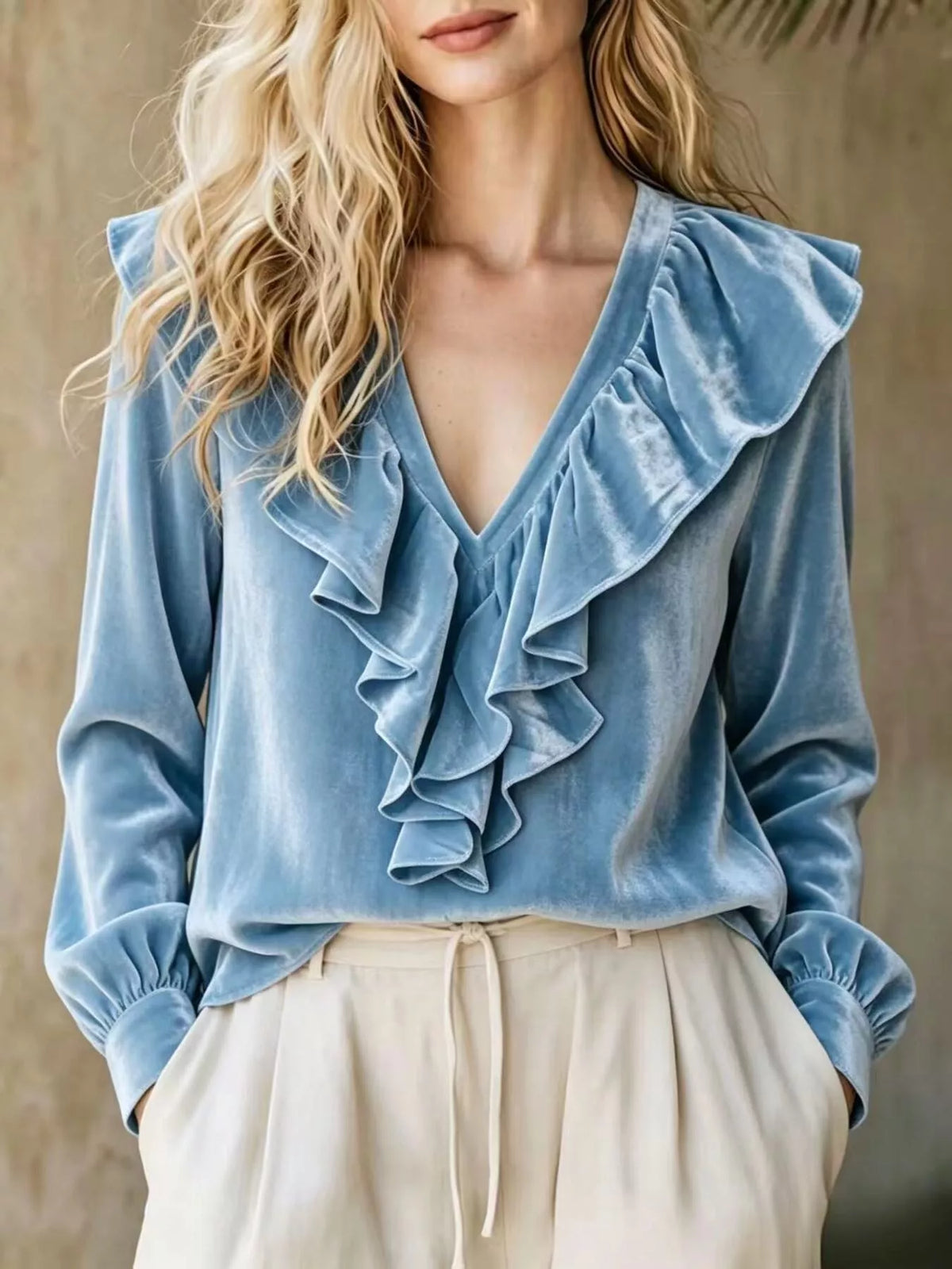 Plus size long sleeve V-neck ruffled blouse from Trendsi, featuring a full-length design with feminine ruffle details.