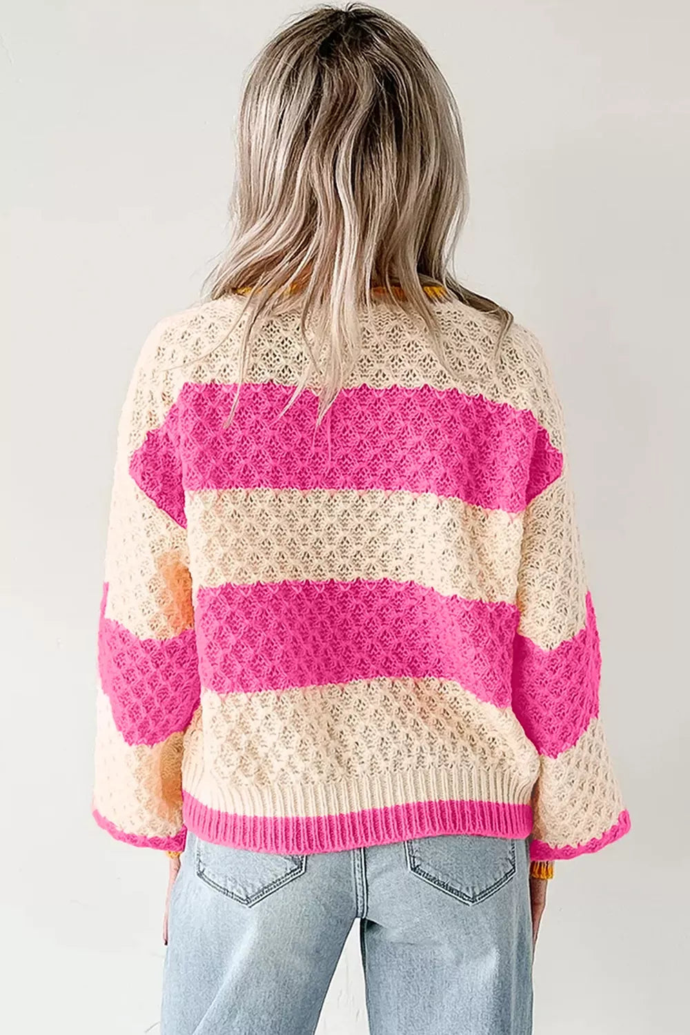 Women's striped colorblock textured drop shoulder sweater by Trendsi, featuring bold stripes and cozy knit fabric.