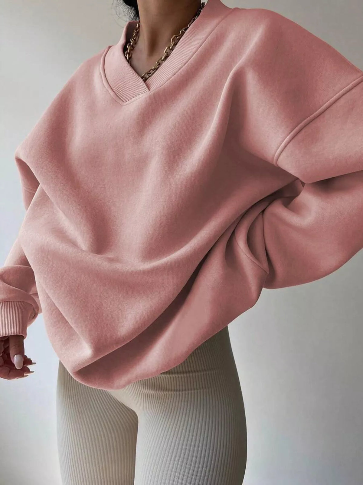 Oversized dropped shoulder long sleeve sweatshirt from Trendsi, featuring a relaxed fit and soft fabric in a casual style.