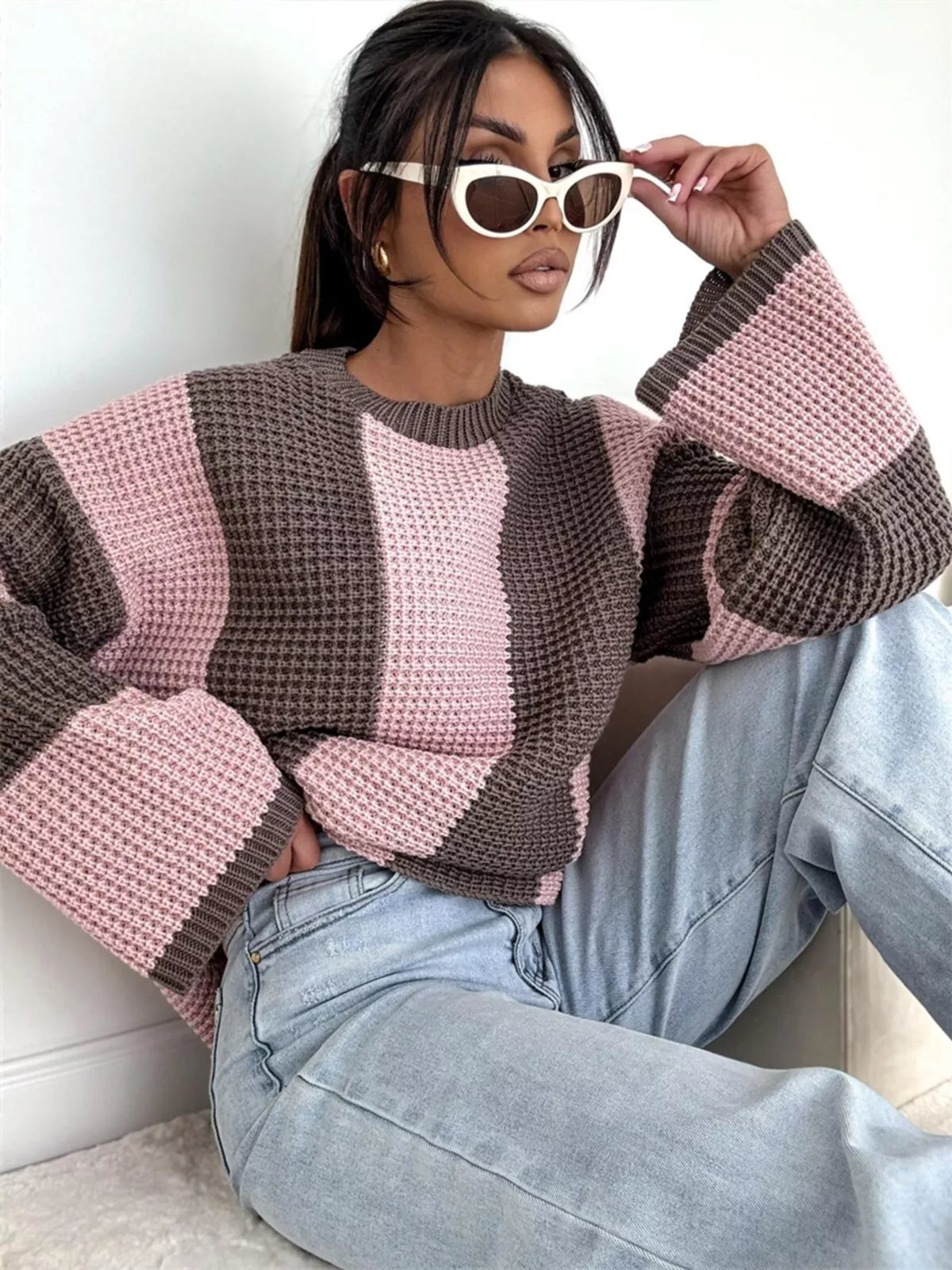 Color block long sleeve sweater by Trendsi featuring a cozy knit design in vibrant color sections.
