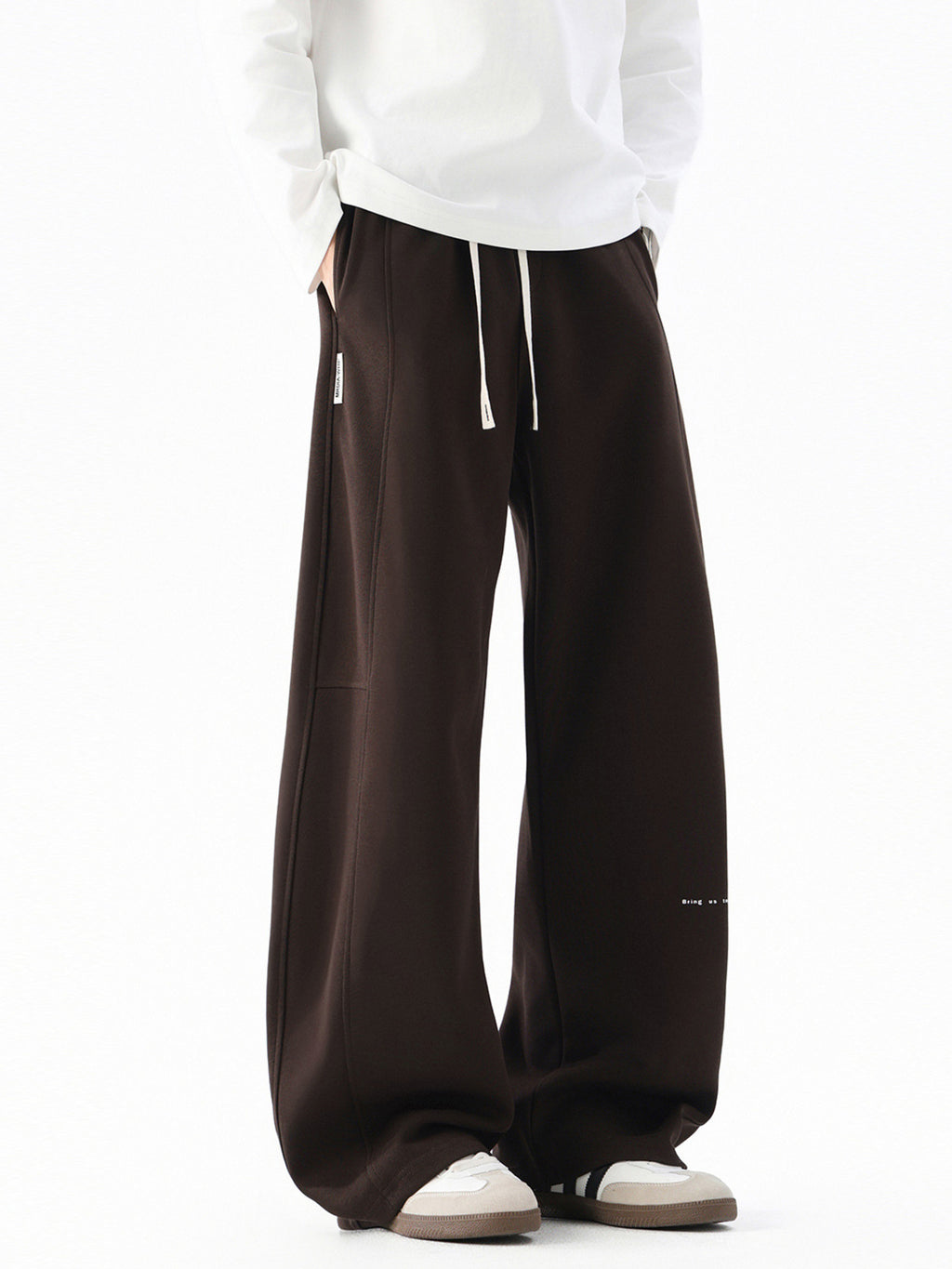 Men's wide leg casual drawstring pants with relaxed fit, shown in neutral color, featuring comfortable waistband and relaxed style.