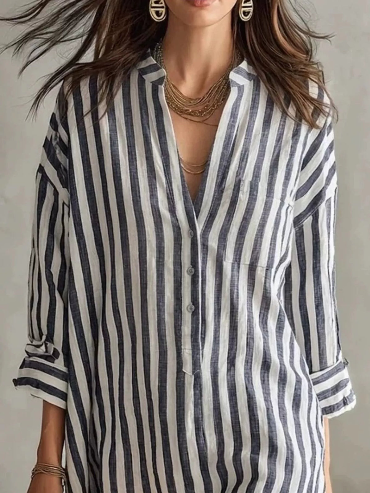 Plus size striped shirt dress with 3/4 sleeves by Trendsi, featuring a casual, relaxed fit and stylish horizontal stripe pattern.
