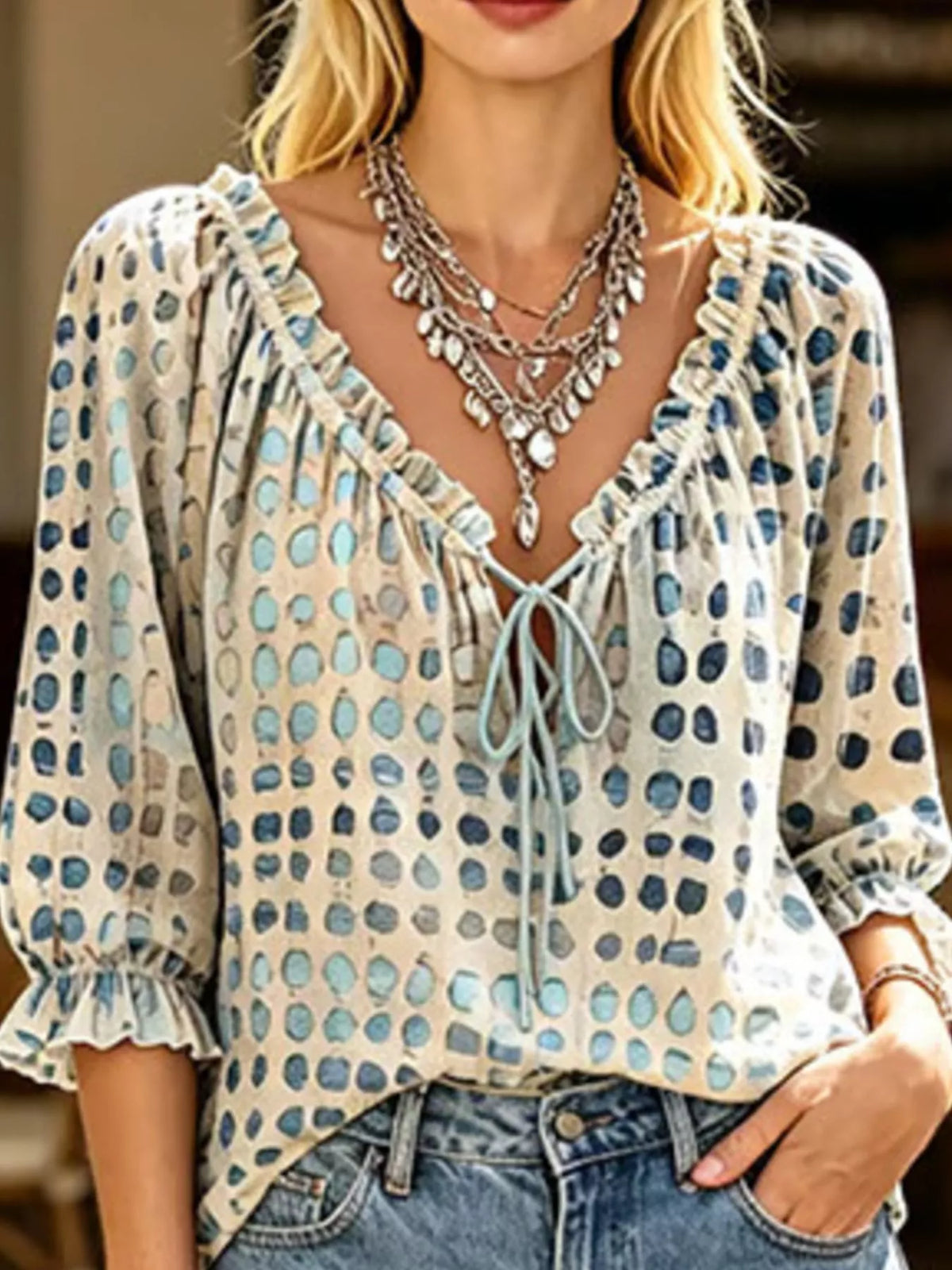 Plus size tie neck blouse with 3/4 sleeves, featuring a stylish design and full-length fit from Trendsi.