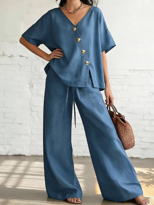 Plus size Trendsi surplice half sleeve top and wide-leg pants set, featuring a stylish, coordinated look in a full-size outfit.