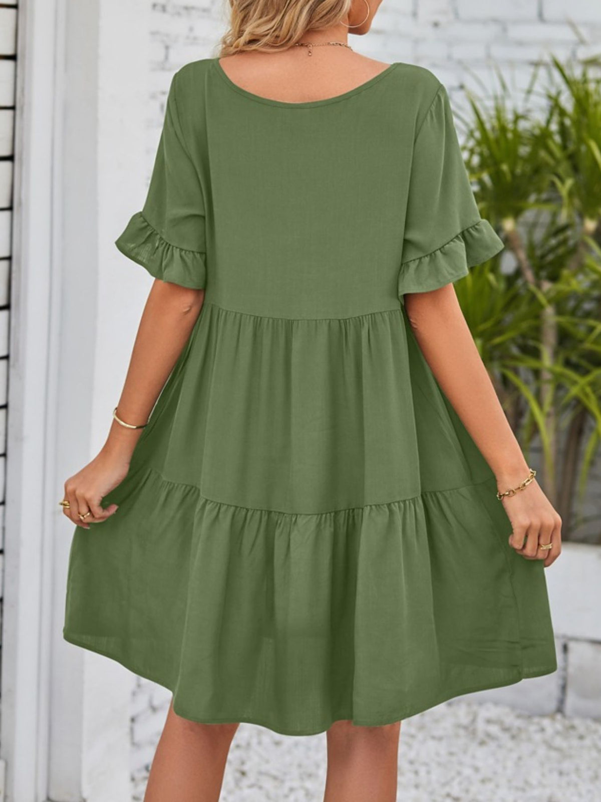 Lightweight rayon ruffled sleeve tiered mini dress with pockets by Plush Fashion Hub, showing the flowy fabric and stylish ruffle details.