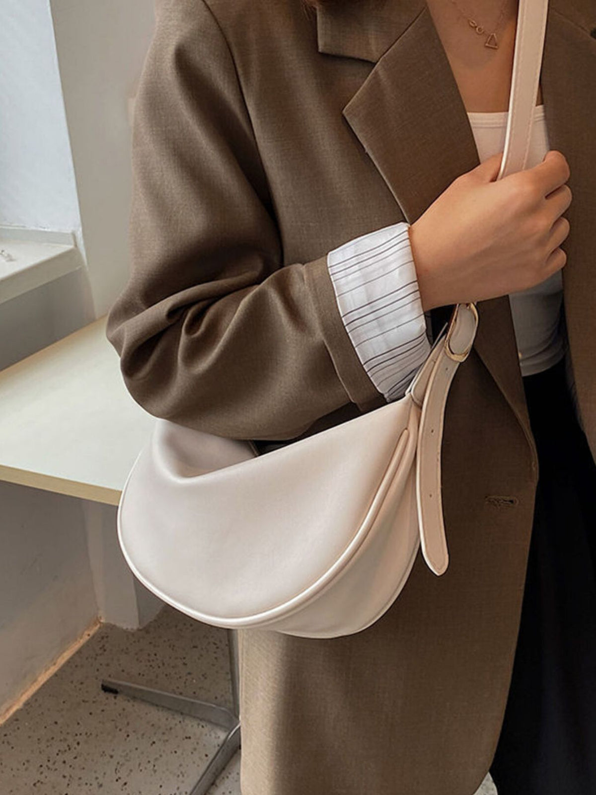 Minimalist Crescent crossbody bag in smooth PU leather, stylish and compact, by Plush Fashion Hub.