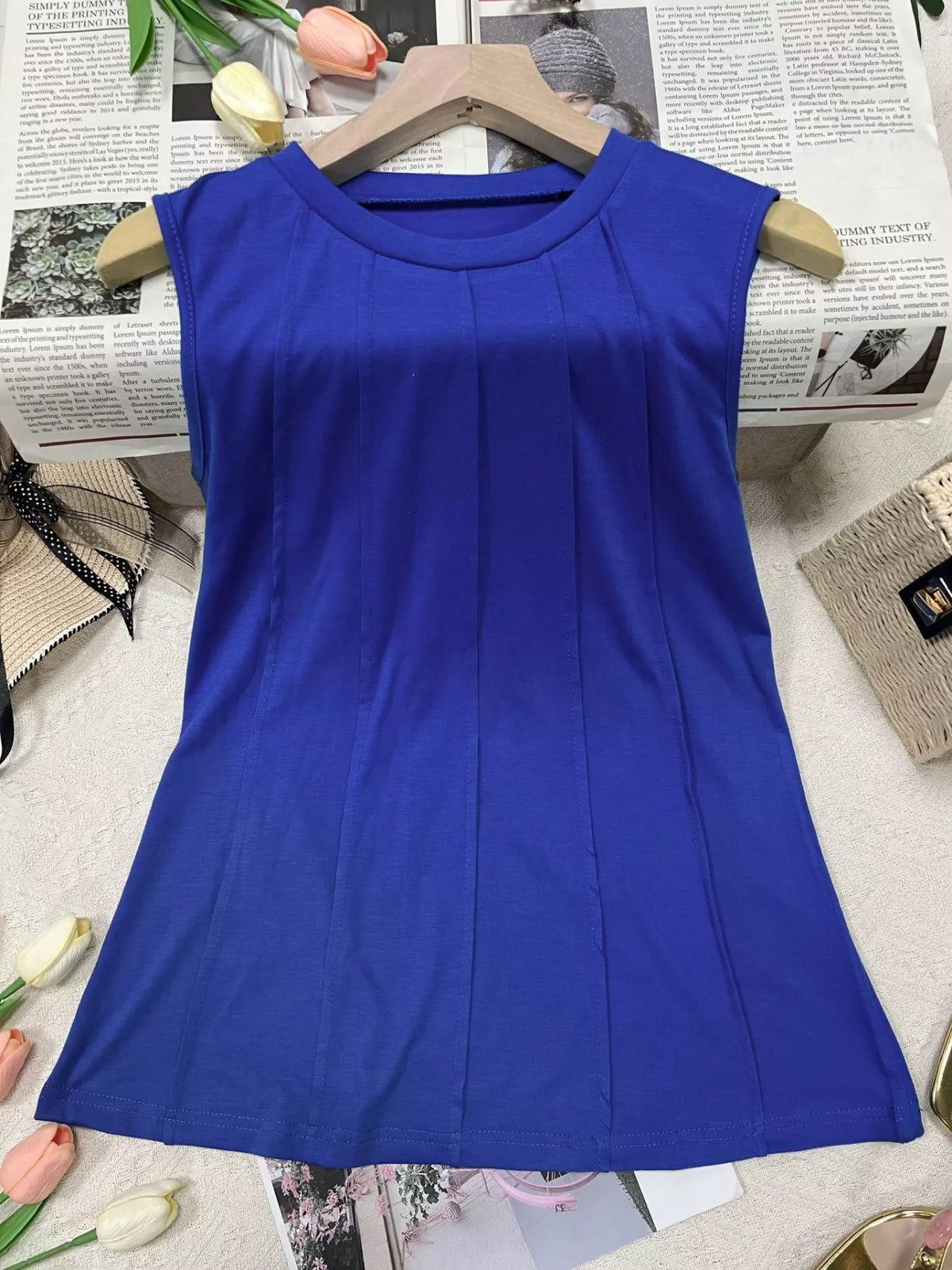 Plush Fashion Hub round neck tank top made of soft plush fabric, displayed on a hanger.