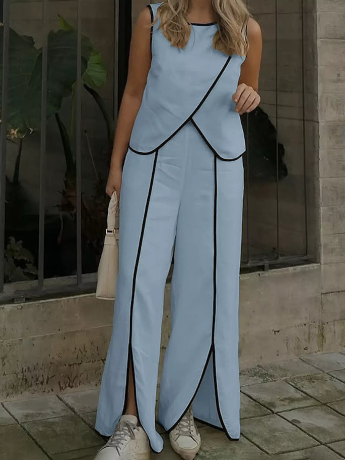 Contrast trim sleeveless top and wide-leg pants two-piece set by Plush Fashion Hub, displayed on a mannequin.