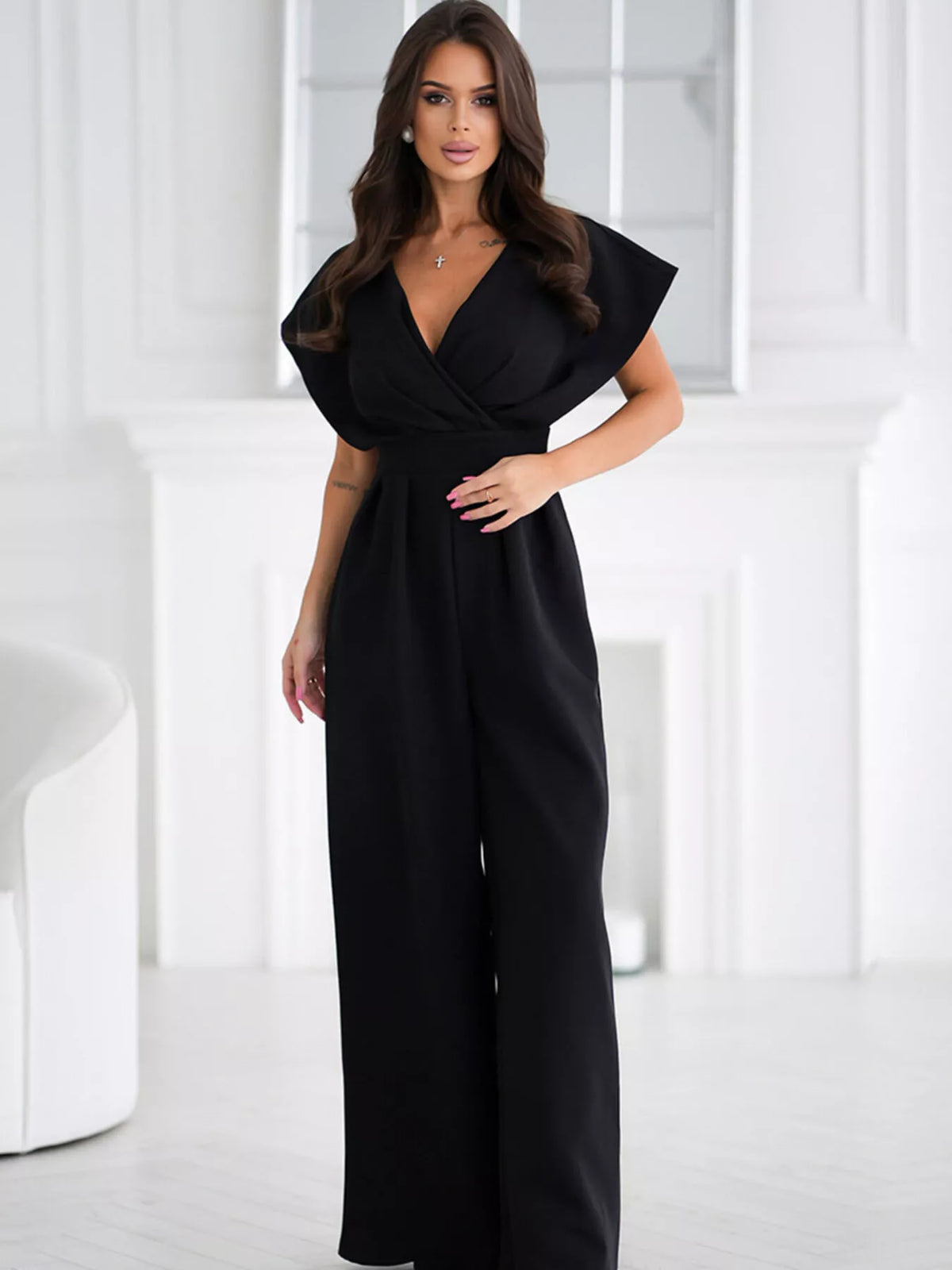 Plush Fashion Hub plush surplice wide-leg jumpsuit displayed on a hanger with a smooth fabric finish and stylish design.