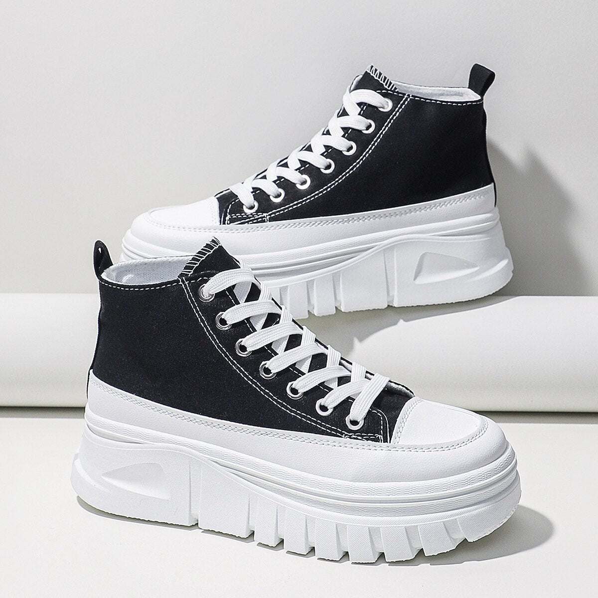 Women Lace-Up Front High Top Platform Canvas ShoesThese women's canvas shoes feature a stylish lace-up front and a high top platform design. With a flat heel, they offer both comfort and height. The height increasinShoePlush Fashion ShopPlush Fashion Shop