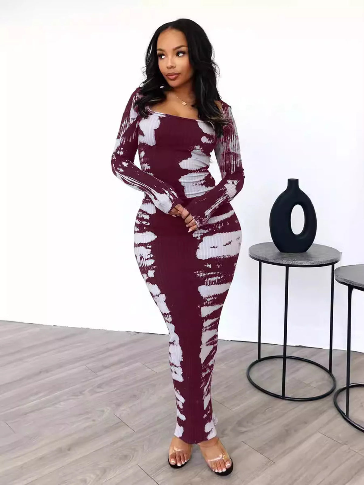 Tie-dye long sleeve maxi dress by Plush Fashion Hub featuring vibrant colors and a flowing, full-length design.