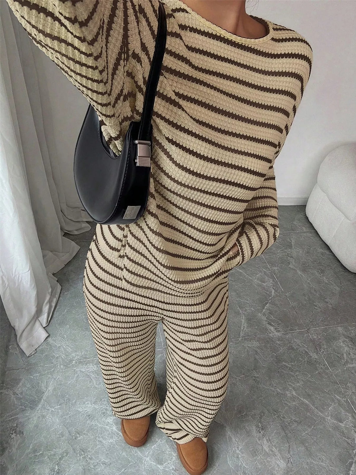 Striped knit dropped shoulder top and matching pants set by Trendsi, casual and comfortable fashion outfit.