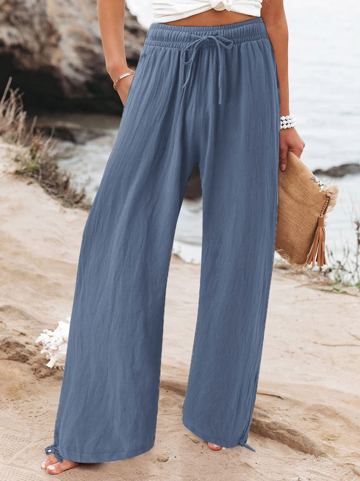 Plus size full length drawstring wide-leg pants from Trendsi, featuring a relaxed fit and flowing fabric in a versatile style.