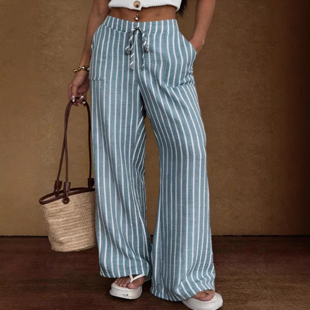 Women's striped wide-leg trousers by Plush Fashion Hub with lace-up elastic waist and loose fit, shown on a model.