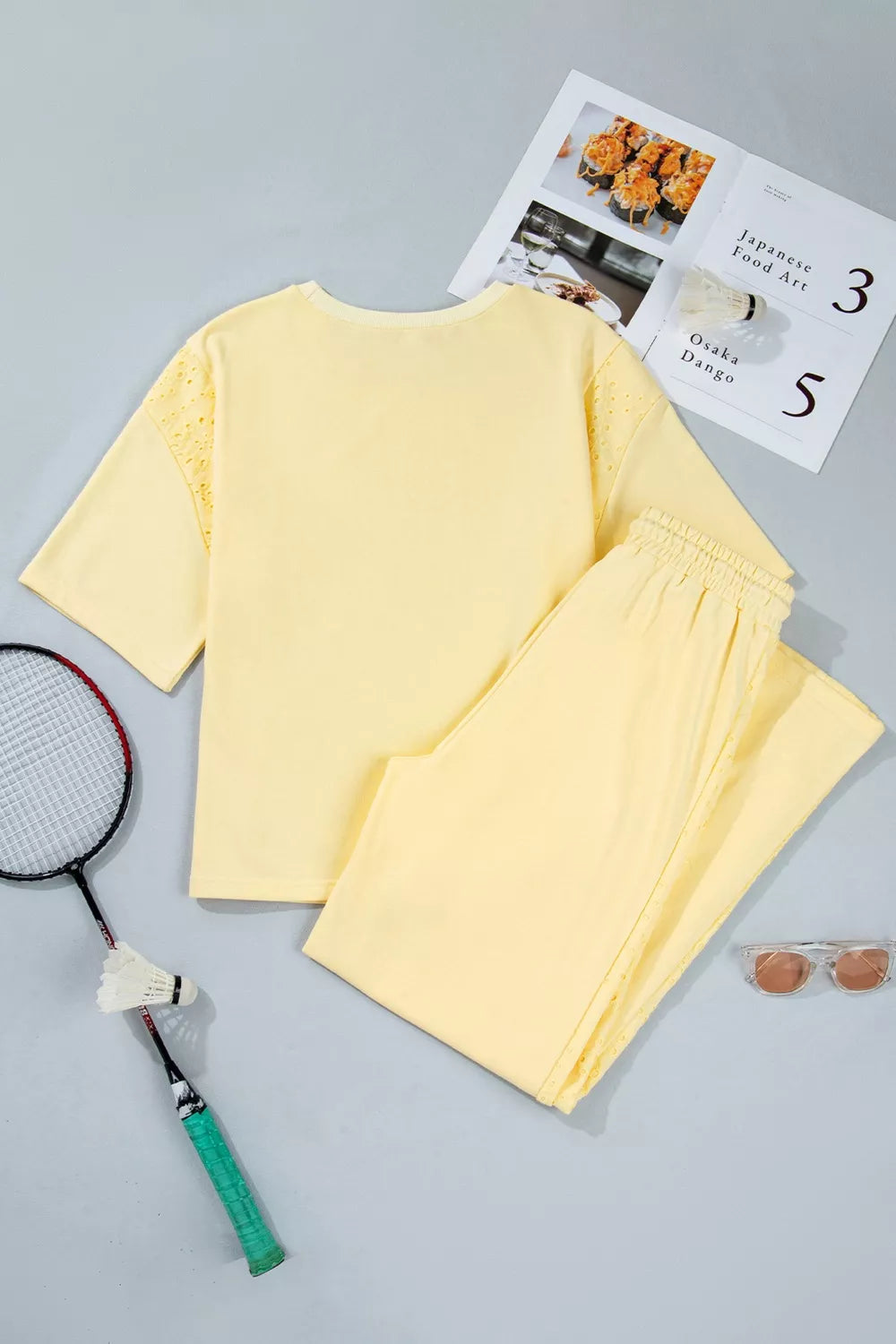 Trendsi rings set featuring a half sleeve top and drawstring pants with stylish ring accents, shown in a sleek, modern design.