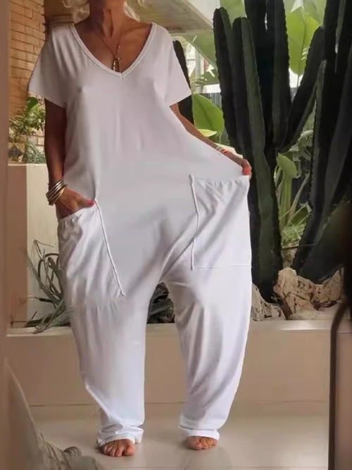 Plus size loose fit V-neck short sleeve jumpsuit with wide legs, trendy and comfortable from Trendsi.