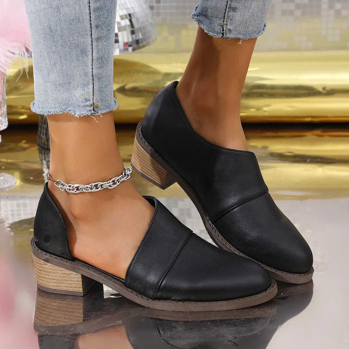 Women's point toe block heel pumps by Trendsi, stylish black shoes with a comfortable chunky heel and sleek design.