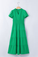 Women's floral ruffled tiered puff sleeve maxi dress by Trendsi, elegant long dress with a flowy silhouette and floral pattern.