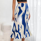 Women's zebra print pleated casual skirt by FitiqueFit with irregular hem and side slit, showcasing the stylish pattern and flowy design.