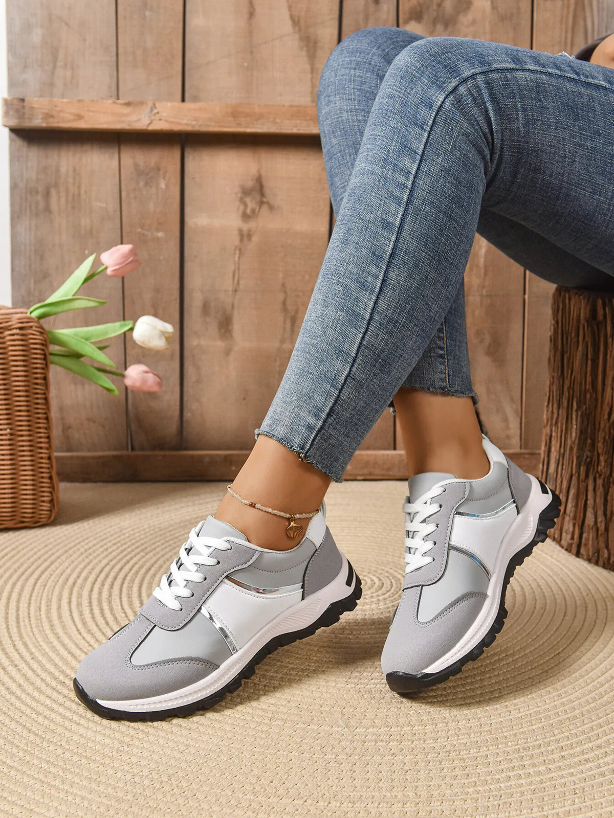 Contrast lace-up sneakers in black and white by Trendsi, featuring a stylish design and comfortable footwear for casual wear.