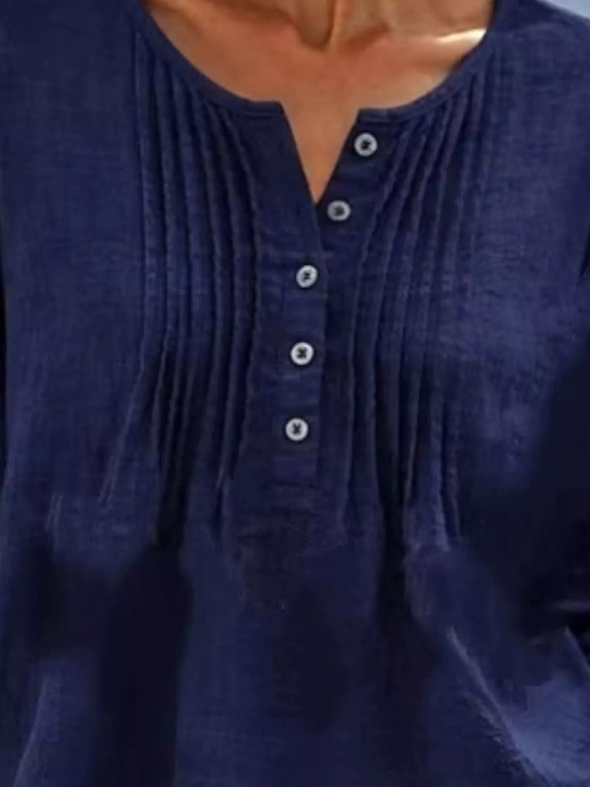 Casual long sleeve linen shirt with button details from Trendsi, featuring a relaxed fit and natural fabric texture.