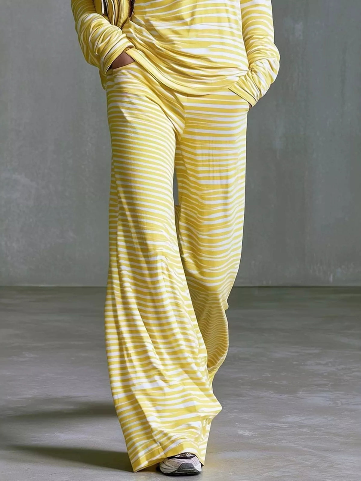 Women’s striped boat neck top and pants set by Trendsi, featuring a stylish, casual matching outfit with a boat neckline and vertical stripes.