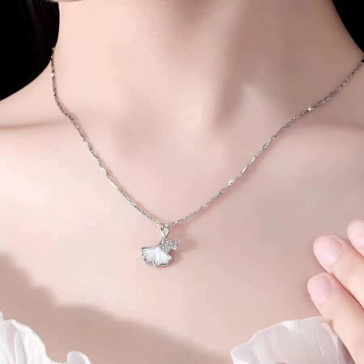 Ginkgo leaf pendant necklace by Plush Fashion Hub featuring a delicate gold-tone ginkgo leaf charm on a chain.