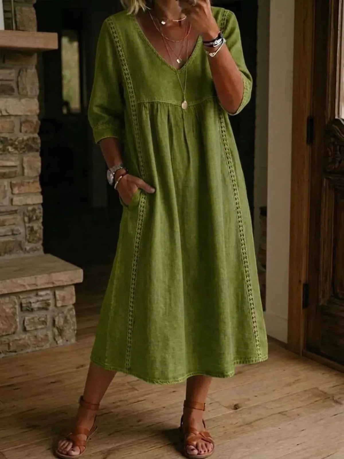 Plus size V-neck midi dress with 3/4 sleeves from Trendsi, featuring a full size fit and stylish design.