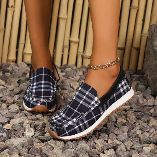 Plaid Round Toe Slip-Ons on rocky surface with bamboo background