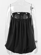 Women's strapless bubble hem tube top by Trendsi, sleek minimalist crop top with a fitted design and trendy style.