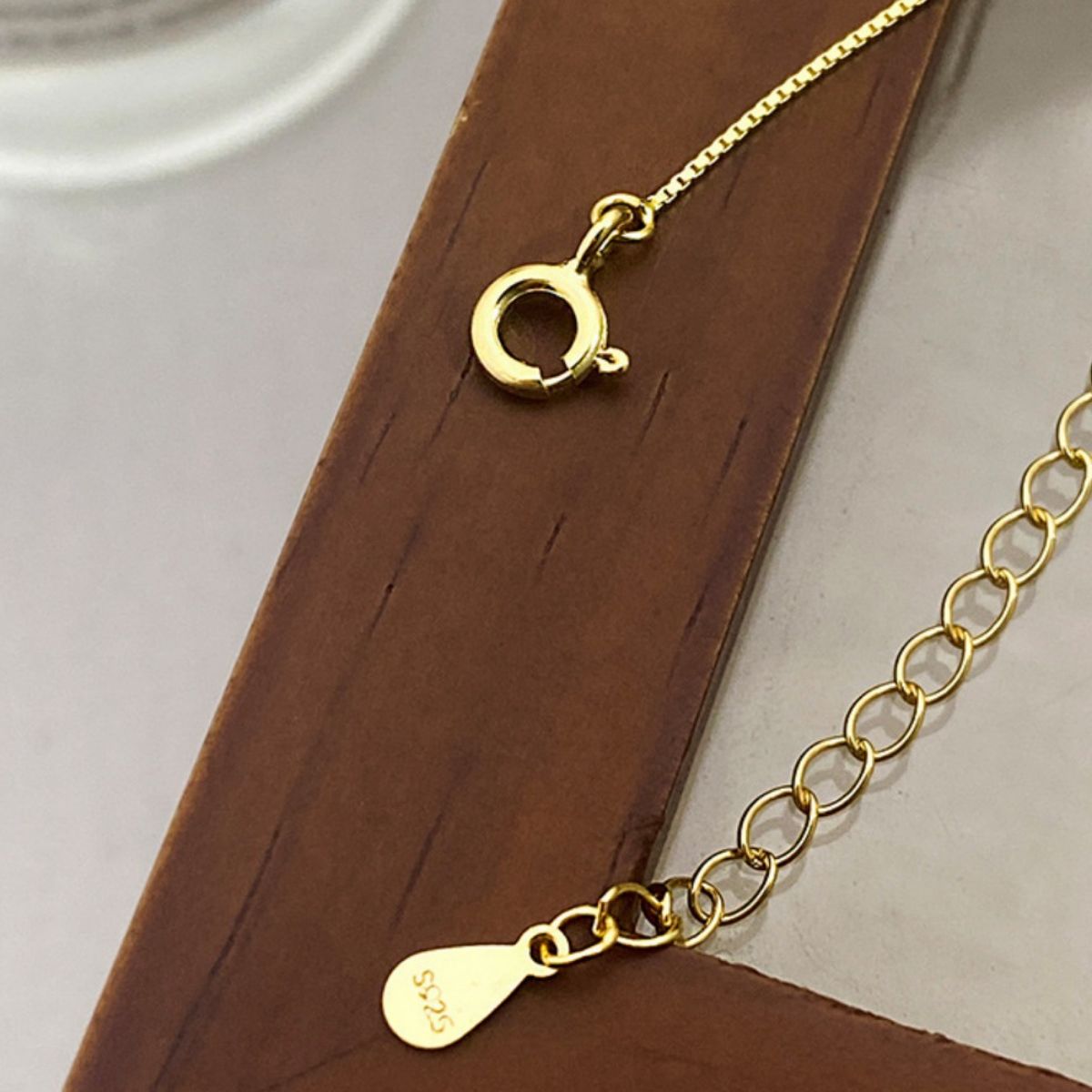 Sterling silver pearl pendant necklace with a delicate design, featuring a lustrous white pearl on a fine chain.