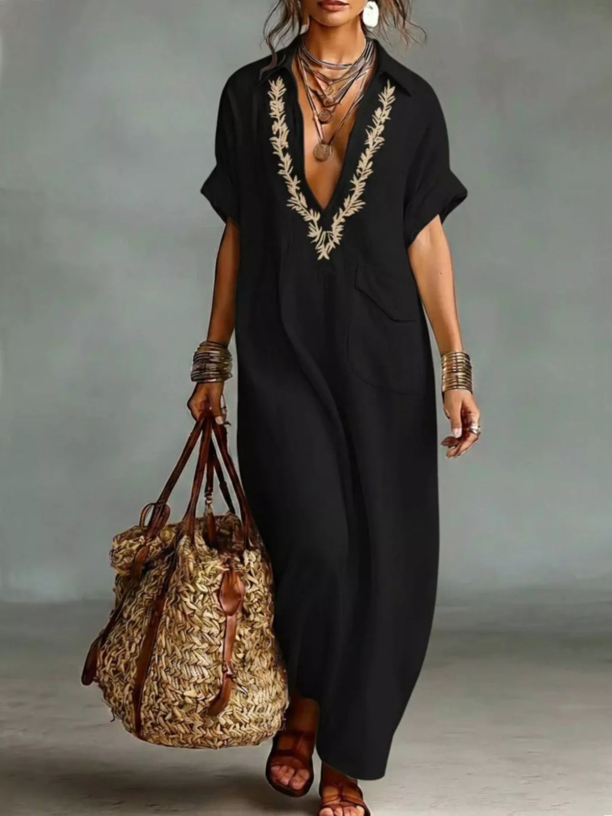 Plus size bohemian embroidered maxi dress with colorful floral patterns, flowing fabric, and relaxed fit.