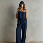 Women's casual two-piece set by FitiqueFit featuring a spaghetti strap cami top and wide-leg pants, perfect for relaxed wear.