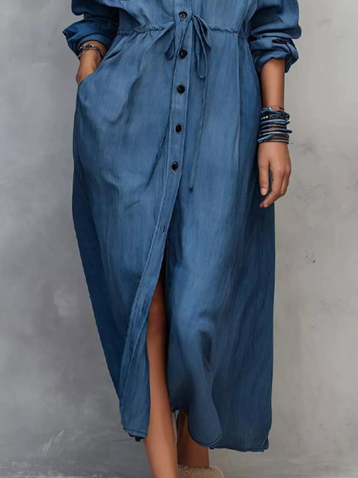Plus size long sleeve button front shirt dress by Trendsi, featuring a relaxed fit and classic collar in a soft, comfortable fabric.