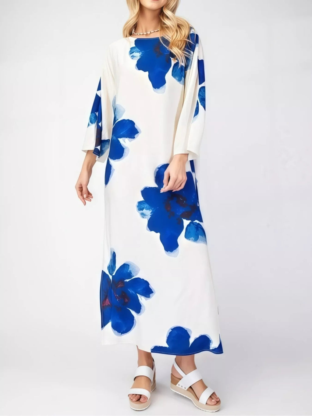 Floral print round neck dress by Trendsi featuring a flowing fabric and vibrant floral pattern on a lightweight dress.
