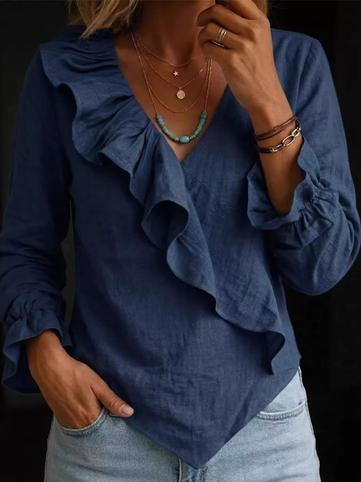 Plus size long sleeve ruffled blouse by Trendsi, featuring feminine ruffles and full-length sleeves, perfect for stylish everyday wear.