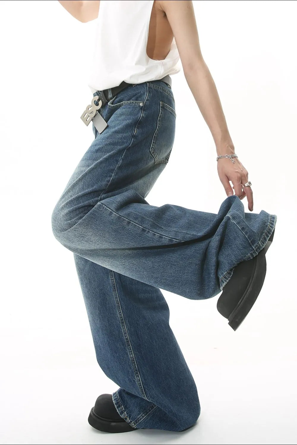Wide leg denim jeans with pockets from Plush Fashion Hub, featuring a relaxed fit and classic blue denim fabric.