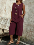 Casual solid-colored sleeveless top and cropped pants two-piece set by Plush Fashion Hub, shown in a relaxed casualwear style.