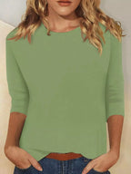Solid color round neck T-shirt by Trendsi, showing a close-up of the soft fabric and classic fit in a versatile design.