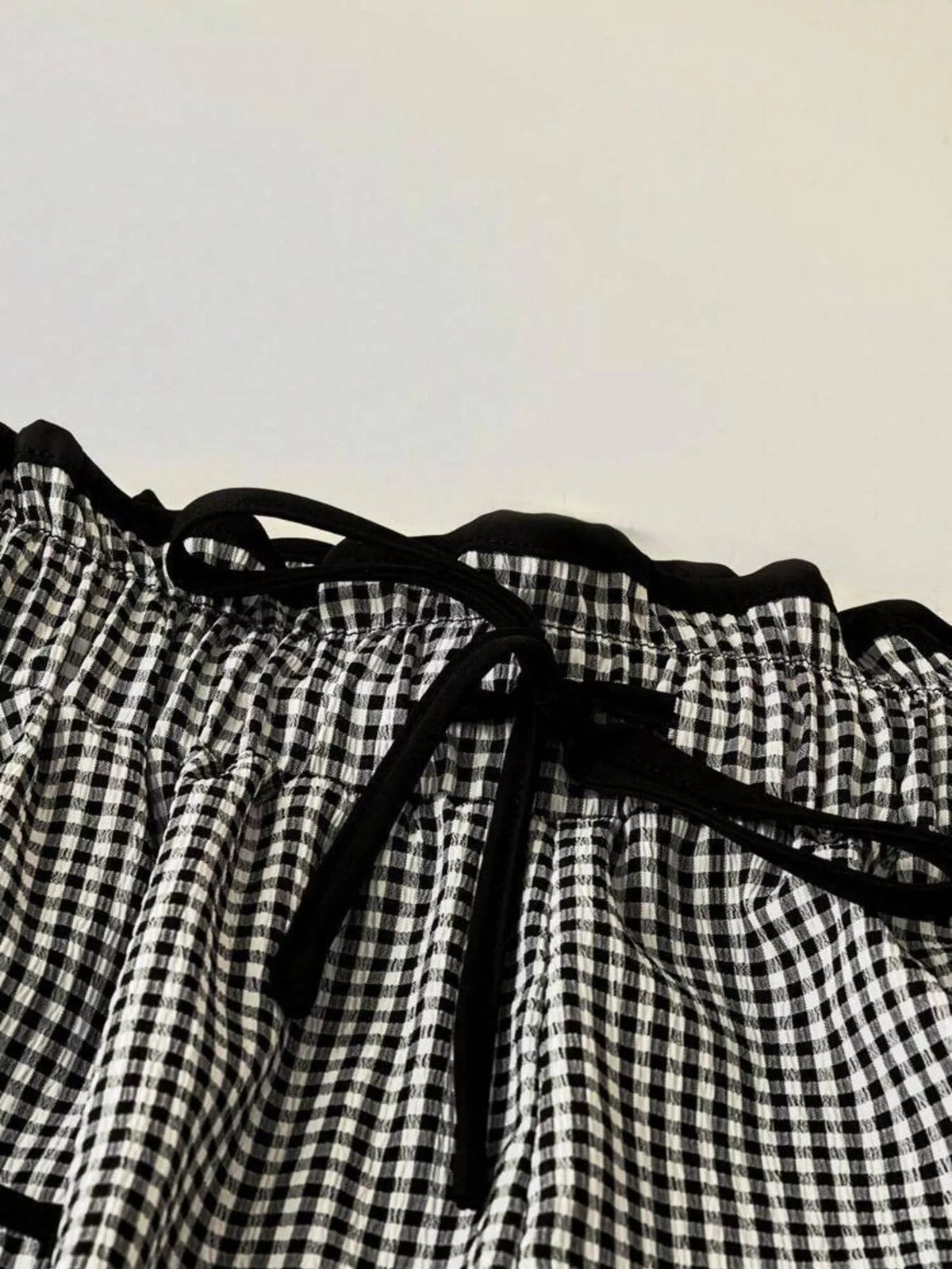 Women’s high-waisted gingham wide-leg pants with pockets, stylish and comfortable, by Plush Fashion Hub.
