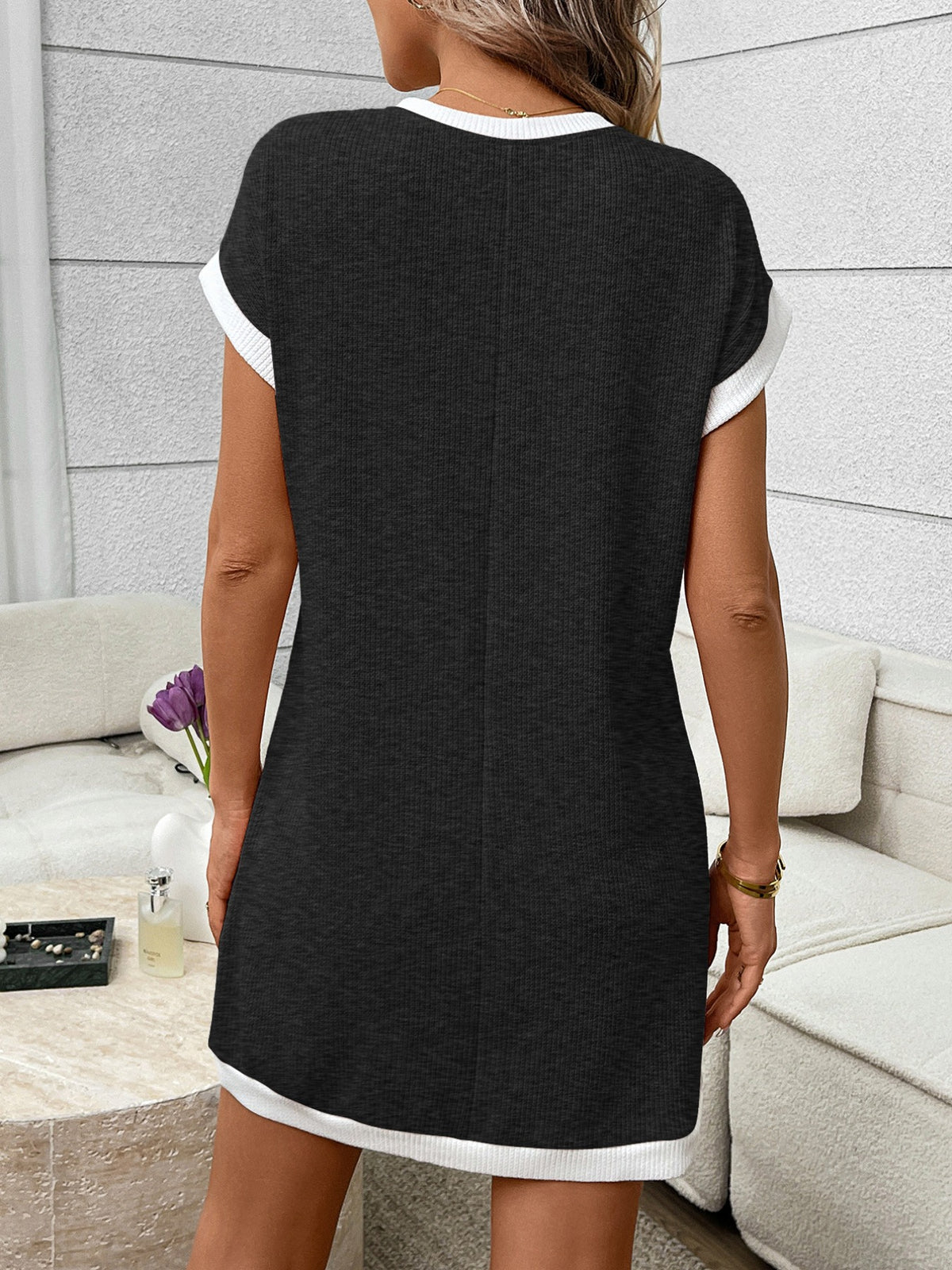 Ribbed knit mini dress by Plush Fashion Hub featuring contrast trim and a functional pocket, worn by a model.