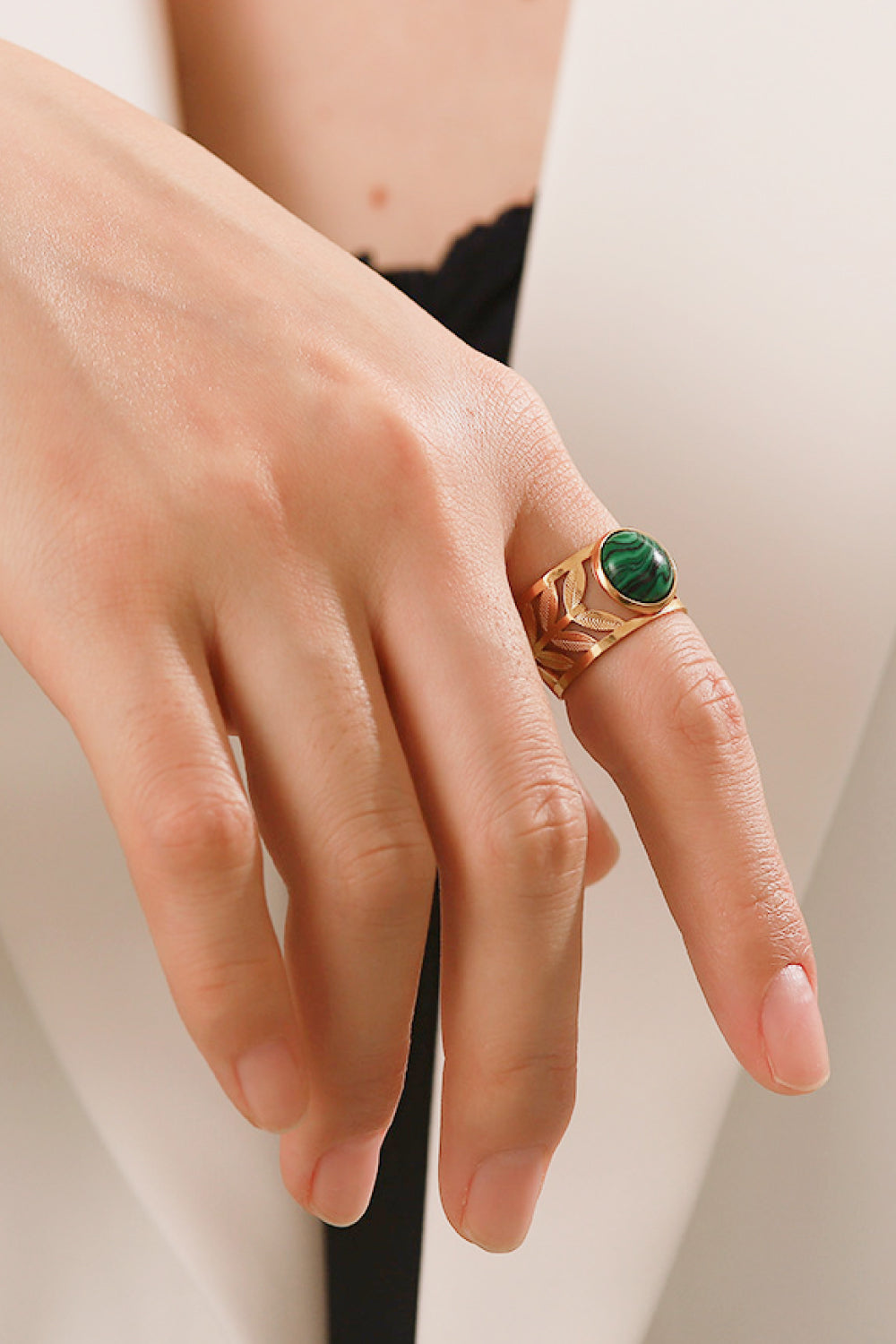 Gold plated malachite leaf ring with intricate design, showcasing vibrant green stone and detailed metalwork, jewelry accessory.