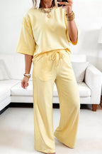 Trendsi rings half sleeve top and drawstring pants set, featuring silver rings embellishments on the fabric, casual and stylish clothing.