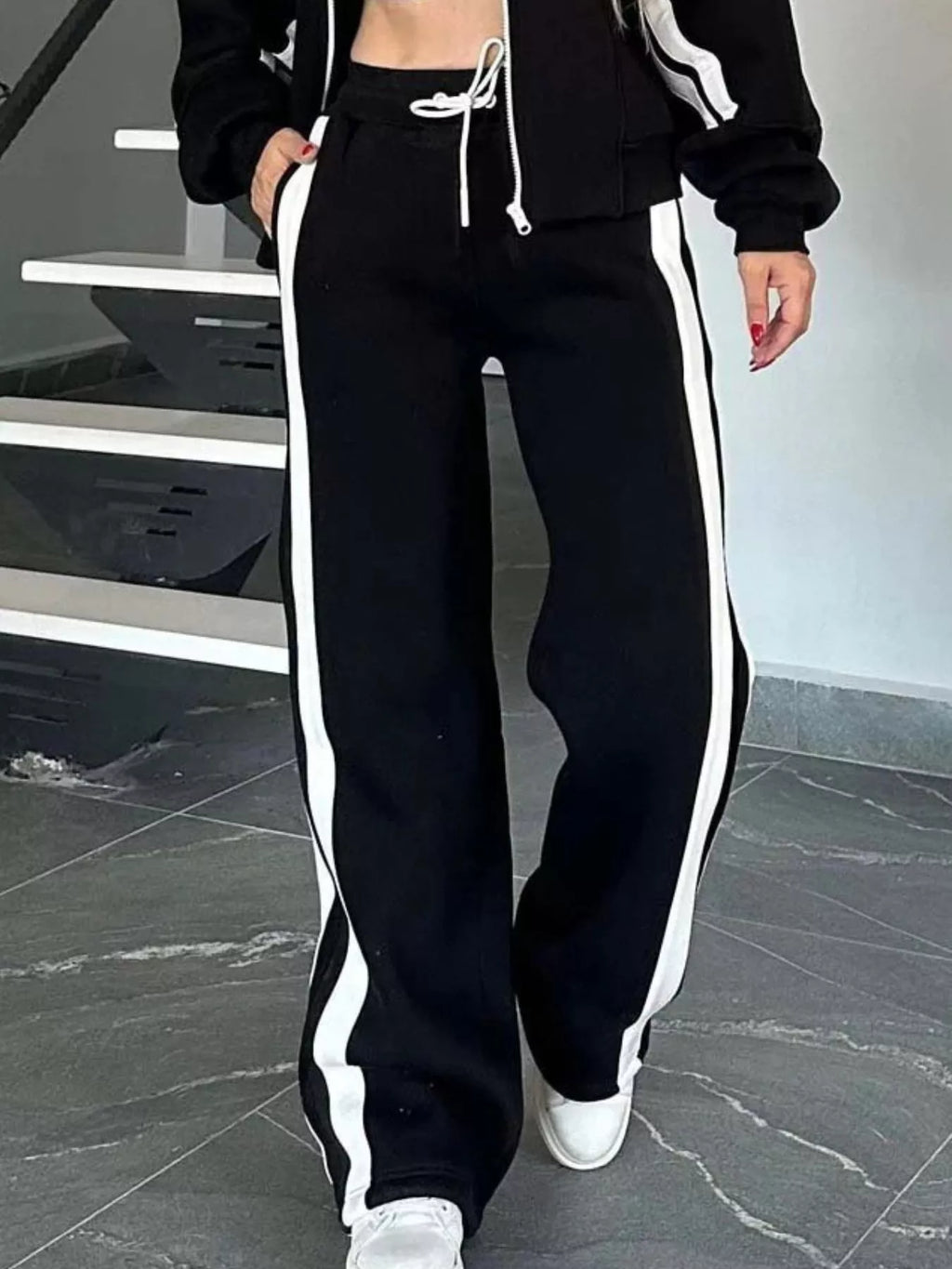 Plus size contrast stripe zip-up activewear jacket and pants set by Plush Fashion Hub, featuring bold stripe details and comfortable fit.