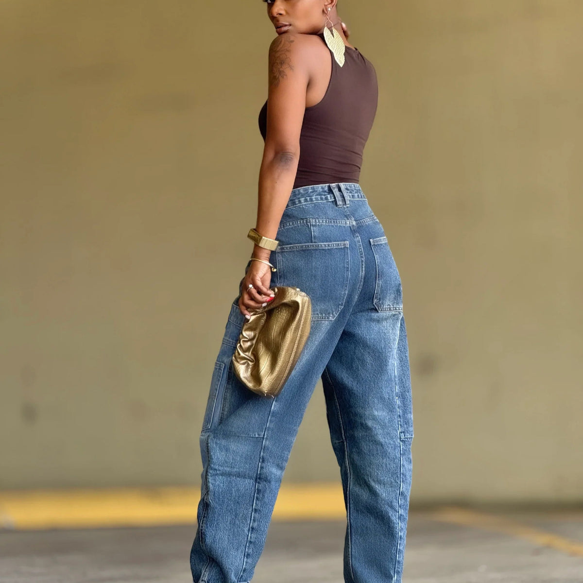 Deconstructed patchwork tapered denim jeans from Plush Fashion Hub with multiple pockets and a stylish distressed design.