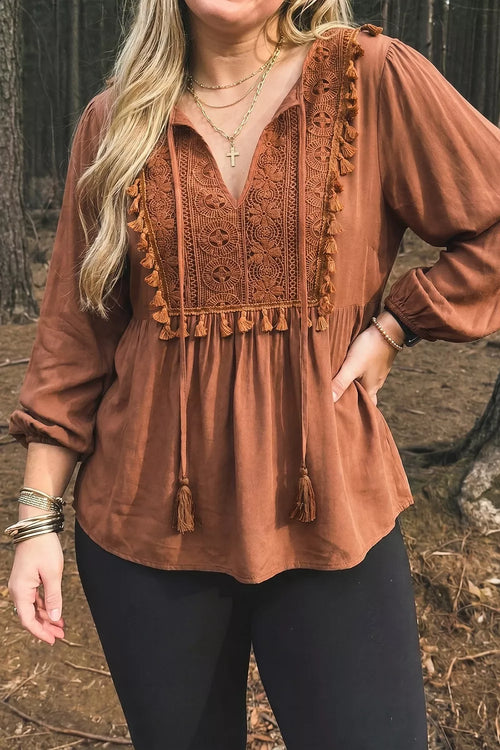 Plus size V-neck embroidered tassel long sleeve blouse from Trendsi, featuring detailed embroidery and flowing fabric.