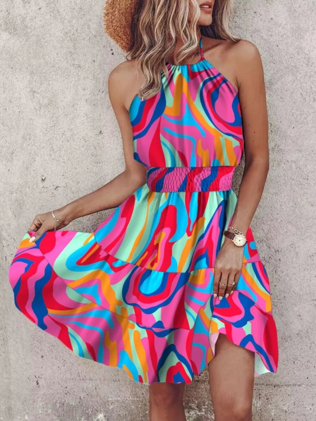 Paisley print halter neck mini dress by Plush Fashion Hub, featuring a fitted bodice and flowing skirt in vibrant fabric.