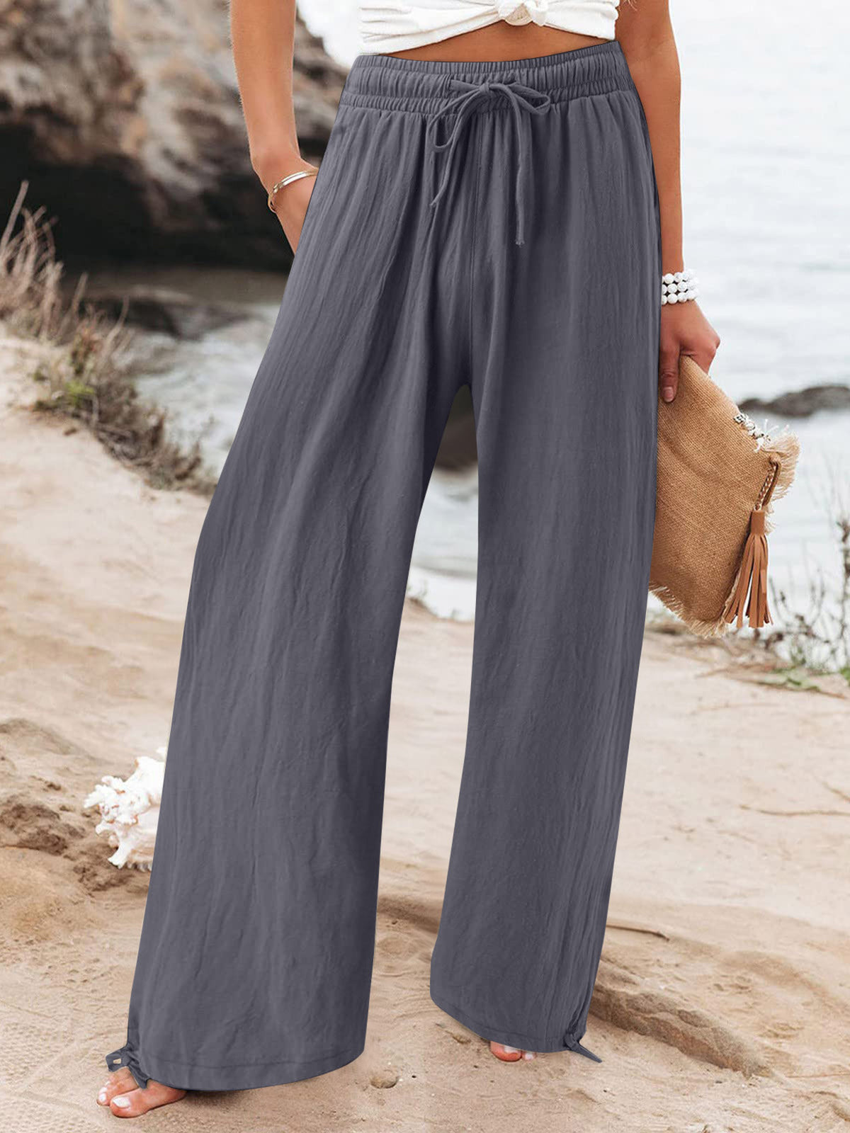 Plus size full length drawstring wide leg pants by Trendsi, featuring a comfortable fit and flowing silhouette.