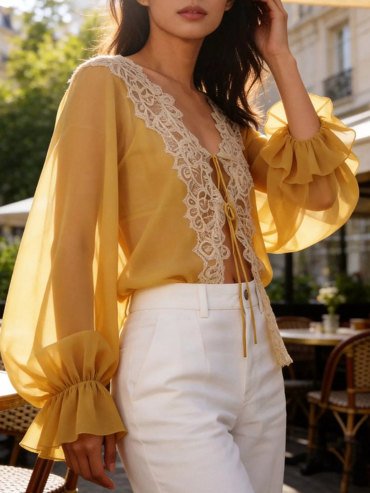 Sheer lace-trimmed front tie blouse for women, featuring lightweight fabric and elegant design, by Trendsi.