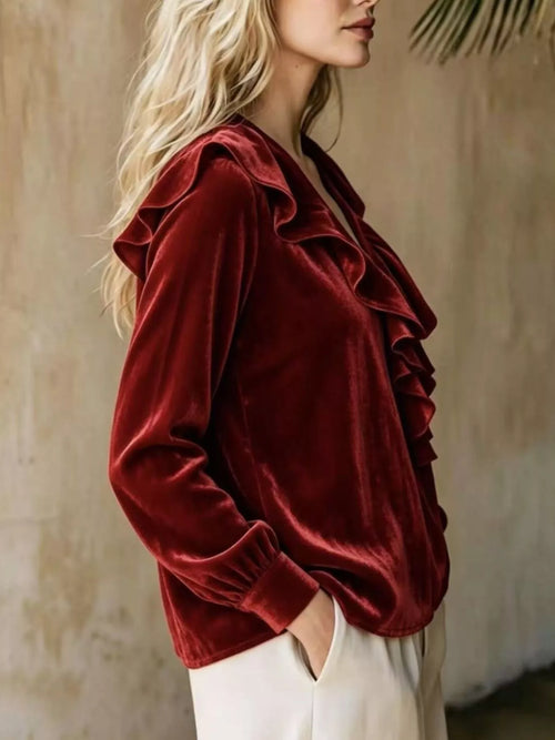 Plus size ruffled V-neck long sleeve blouse from Trendsi, featuring a flattering fit and stylish design with ruffle details.